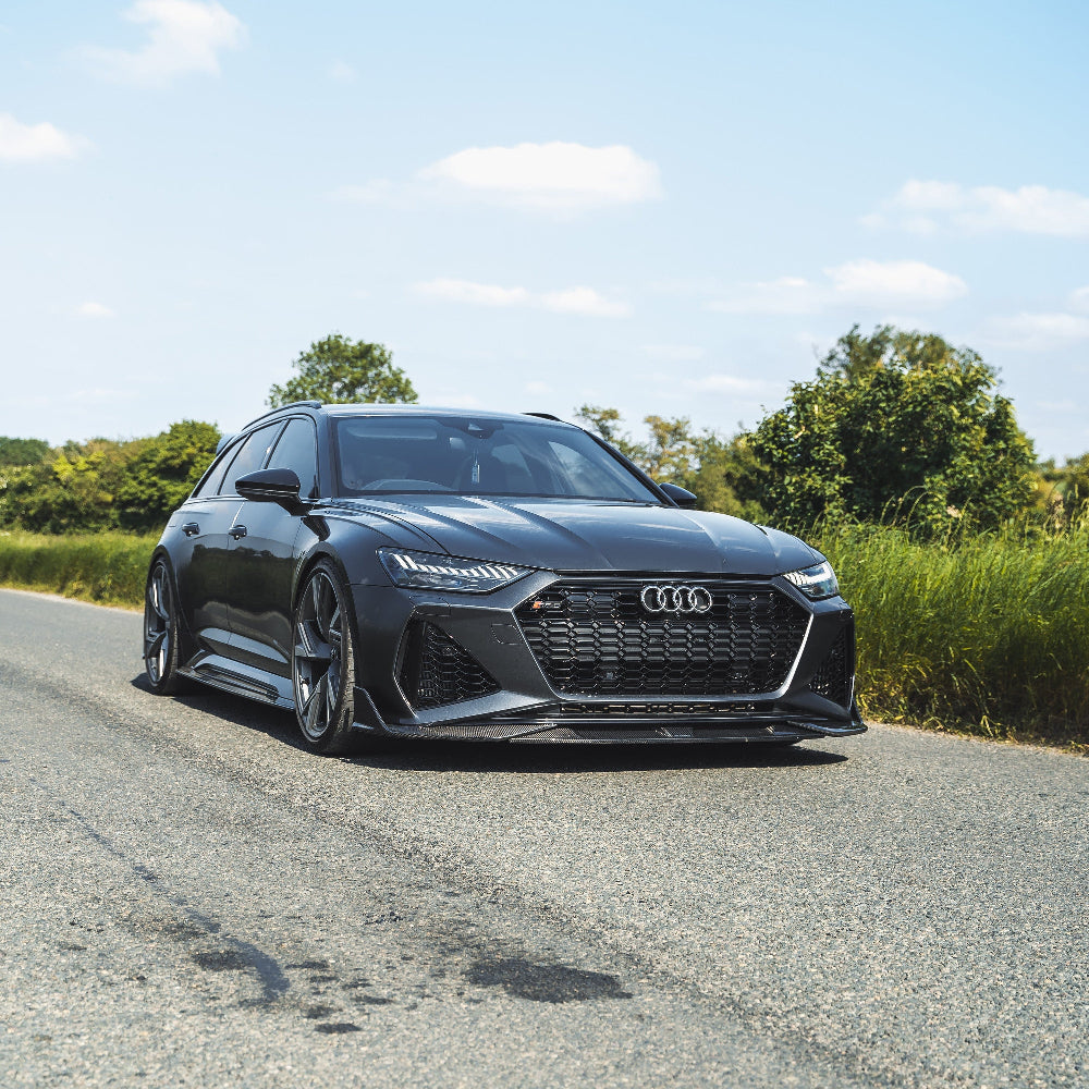 Carbon fibre splitter for Audi RS6 and RS7 C8 Avant 2019+ by CT Carbon, shown on the vehicle's front bumper.