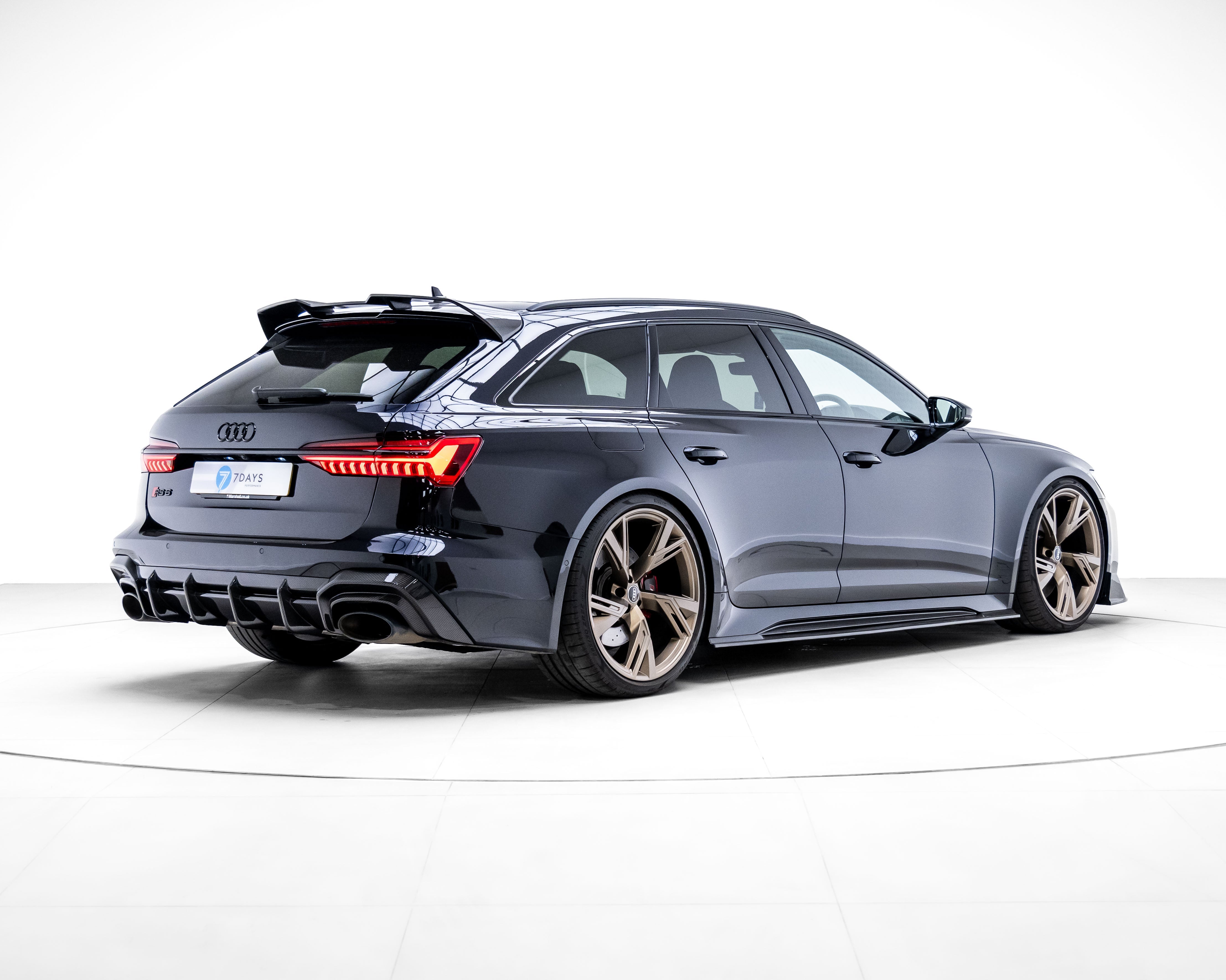 Carbon fibre diffuser for Audi RS6 and RS7 C8 models by CT Carbon, showcasing sleek, aerodynamic design on the vehicle's rear.
