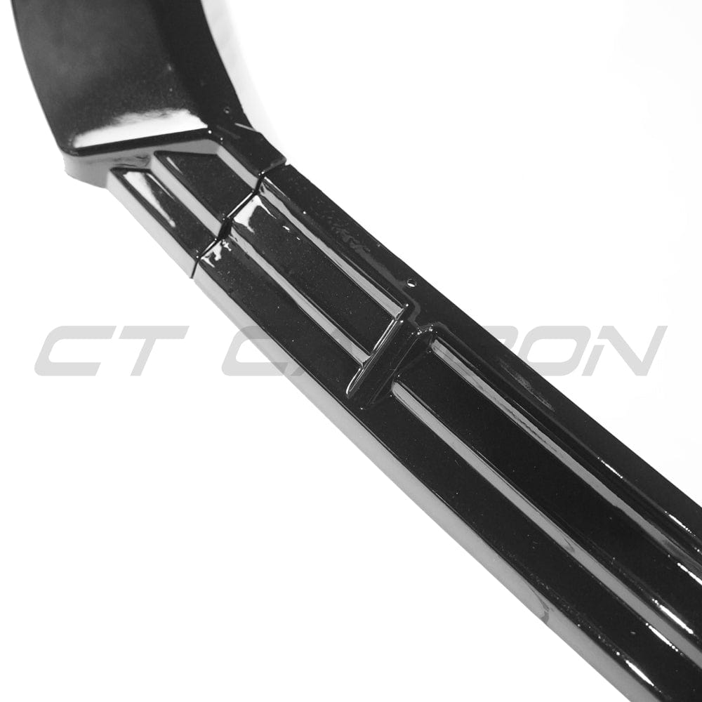 Gloss black splitter for Audi S3/A3 8Y S-Line 2020-2025 by CT Carbon, showing a close-up of the sleek, aerodynamic car accessory.