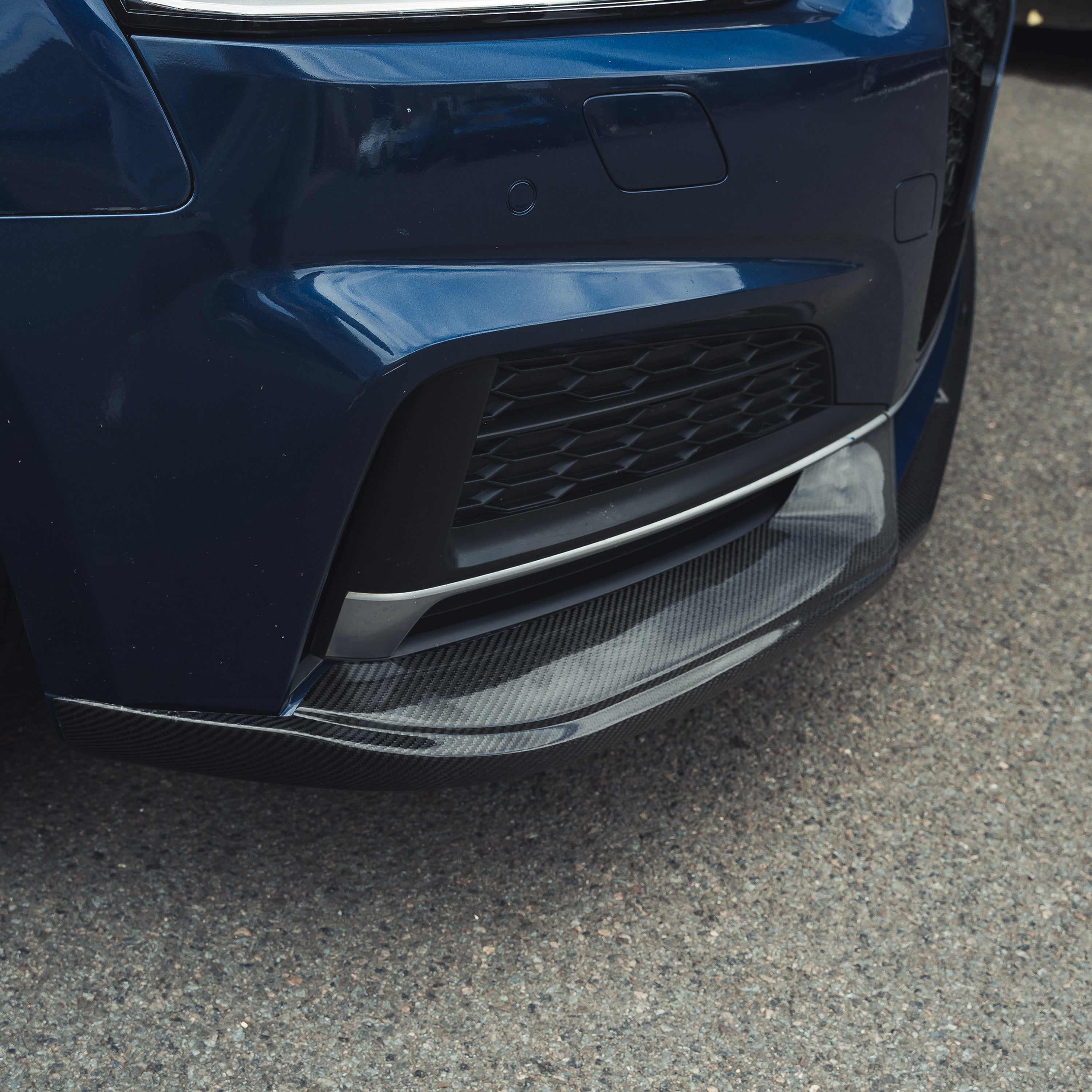 Carbon fiber splitter for Audi A5 S5 B9 2017-2021 by CT Carbon, showing the sleek, aerodynamic front splitter design.