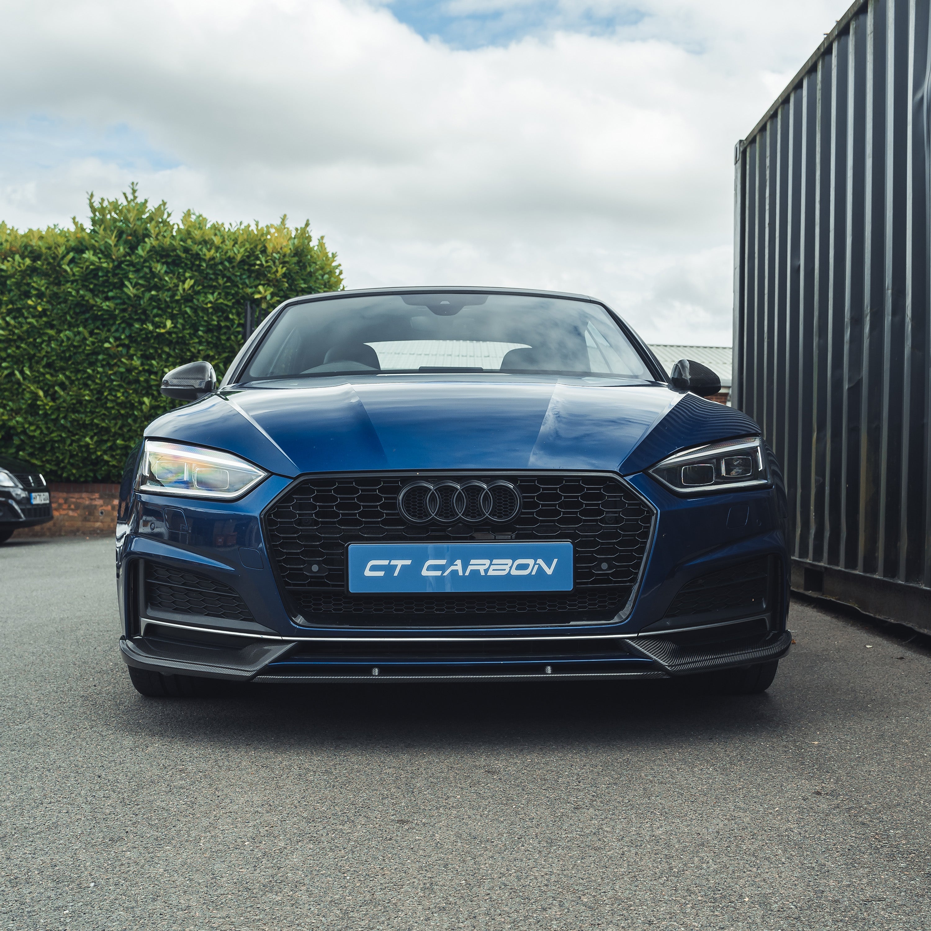 Carbon fiber splitter for Audi A5 S5 B9 (2017-2021) by CT Carbon, showcasing the sleek, aerodynamic design of the car accessory.