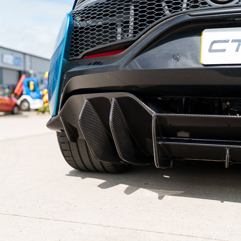 Full view of the CT Carbon McLaren Artura full carbon fiber kit installed on the car, showcasing sleek carbon fiber components.