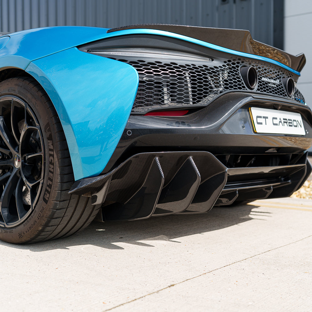 Carbon fiber diffuser for McLaren Artura 2023 by CT Carbon, showcasing sleek aerodynamic design and textured carbon finish.