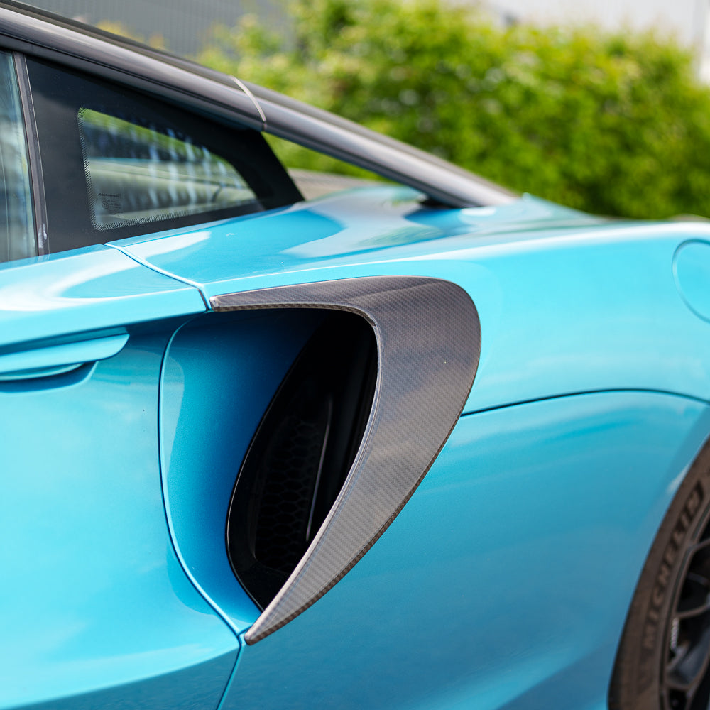 Full view of the CT Carbon McLaren Artura full carbon fibre kit installed on the car, showcasing the sleek carbon fiber finish.