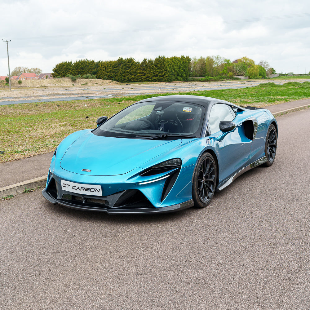 Full car view of a McLaren Artura with CT Carbon V1 full carbon fibre kit, showcasing sleek carbon fibre details on the vehicle.