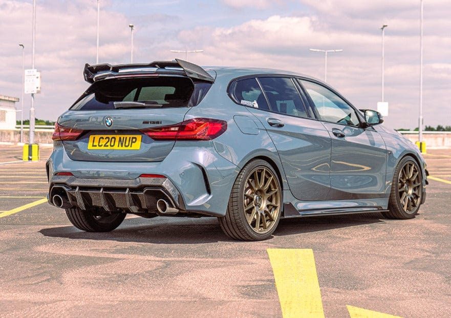 BMW F40 and F70 1 Series carbon fibre spoiler by CT Design, showcasing the sleek, aerodynamic wing mounted on the vehicle.