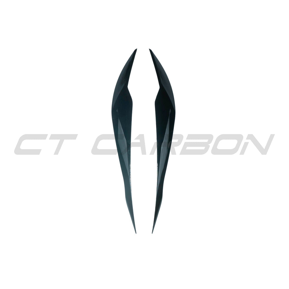 BMW 3 Series F30/F31 gloss black headlight eyebrows by CT Carbon, close-up of sleek black headlight eyelids on car.