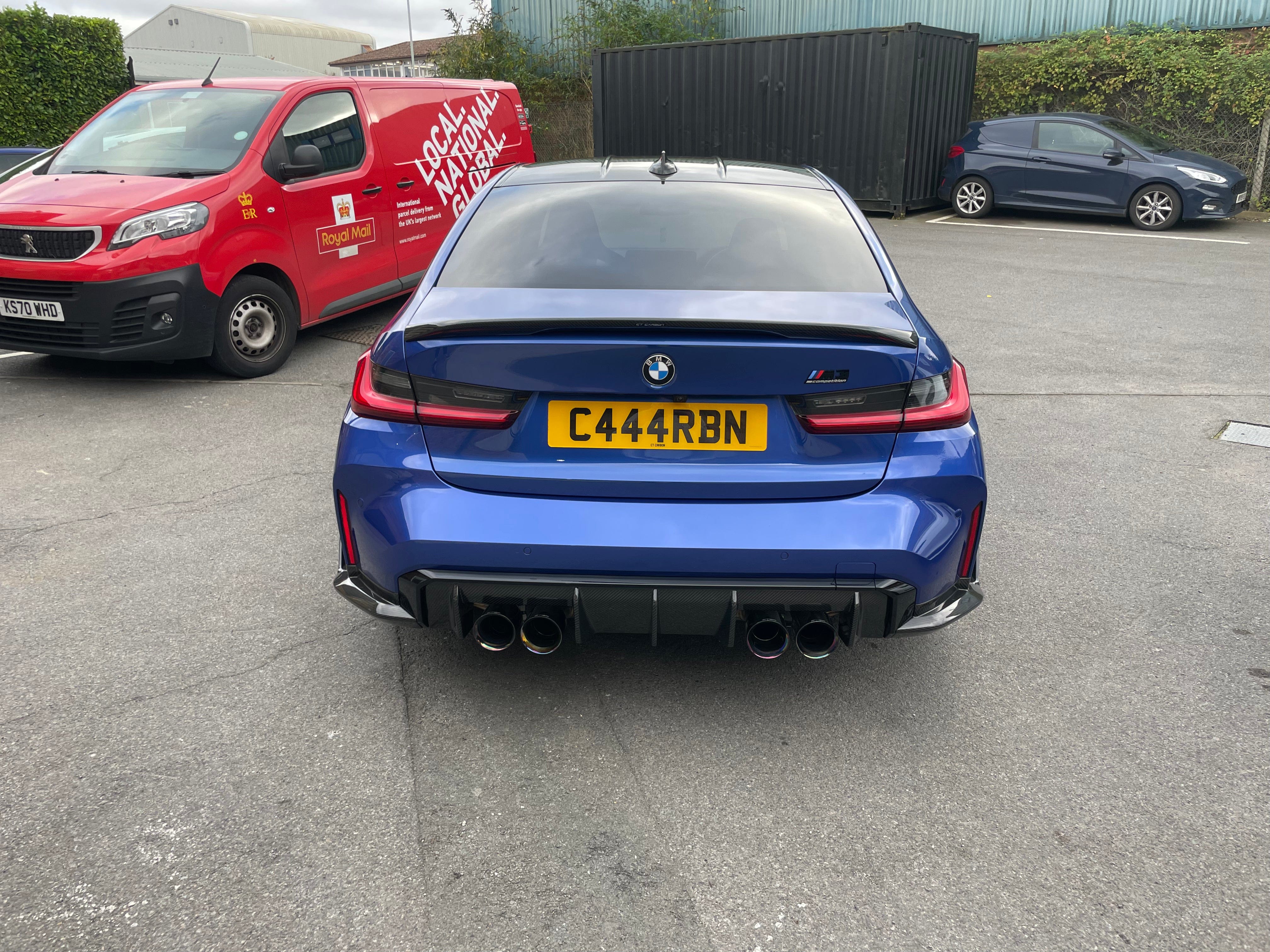 BMW M3 G80 and 3 Series G20 carbon fibre spoiler by CT Carbon, OEM style, showing the sleek, aerodynamic design on the car.