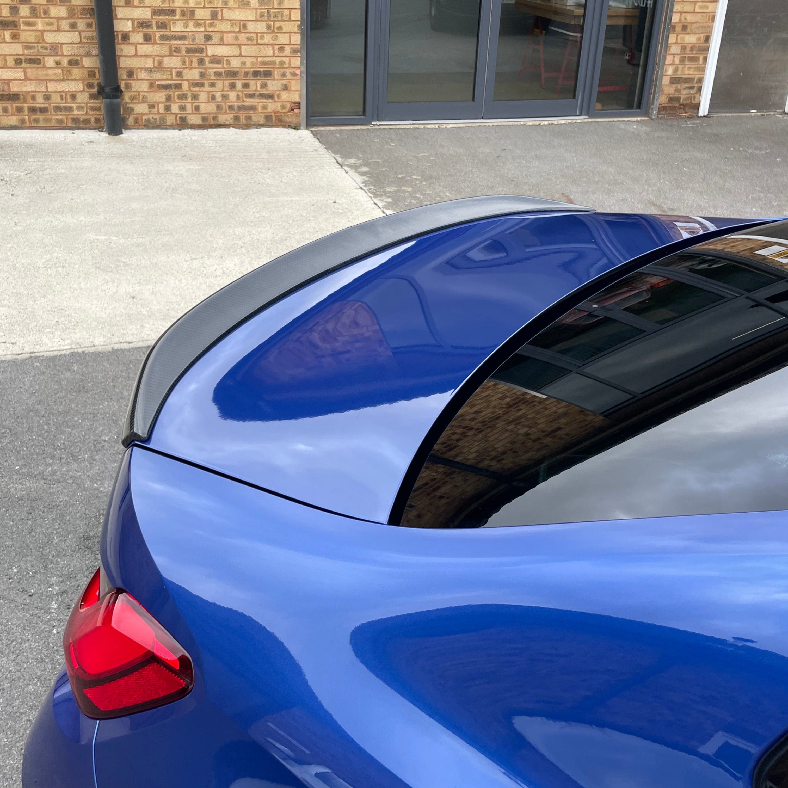 BMW M3 G80 G20 carbon fibre spoiler by CT Carbon, OEM-style, showcasing sleek, lightweight design on the car's rear.