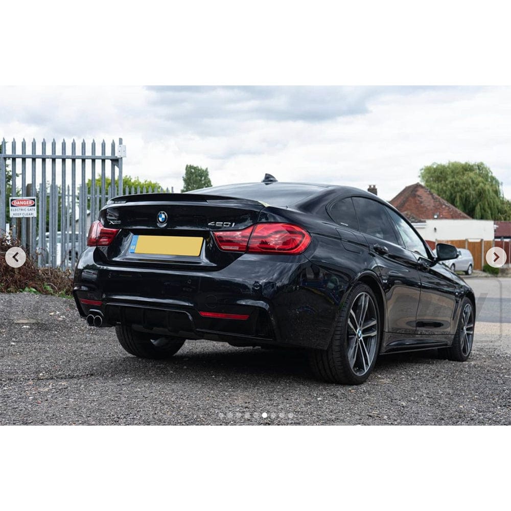 BMW 4 Series F36 2013-2020 CT Carbon gloss black full kit with twin exhaust, MP style, featuring carbon fiber details and sleek design.