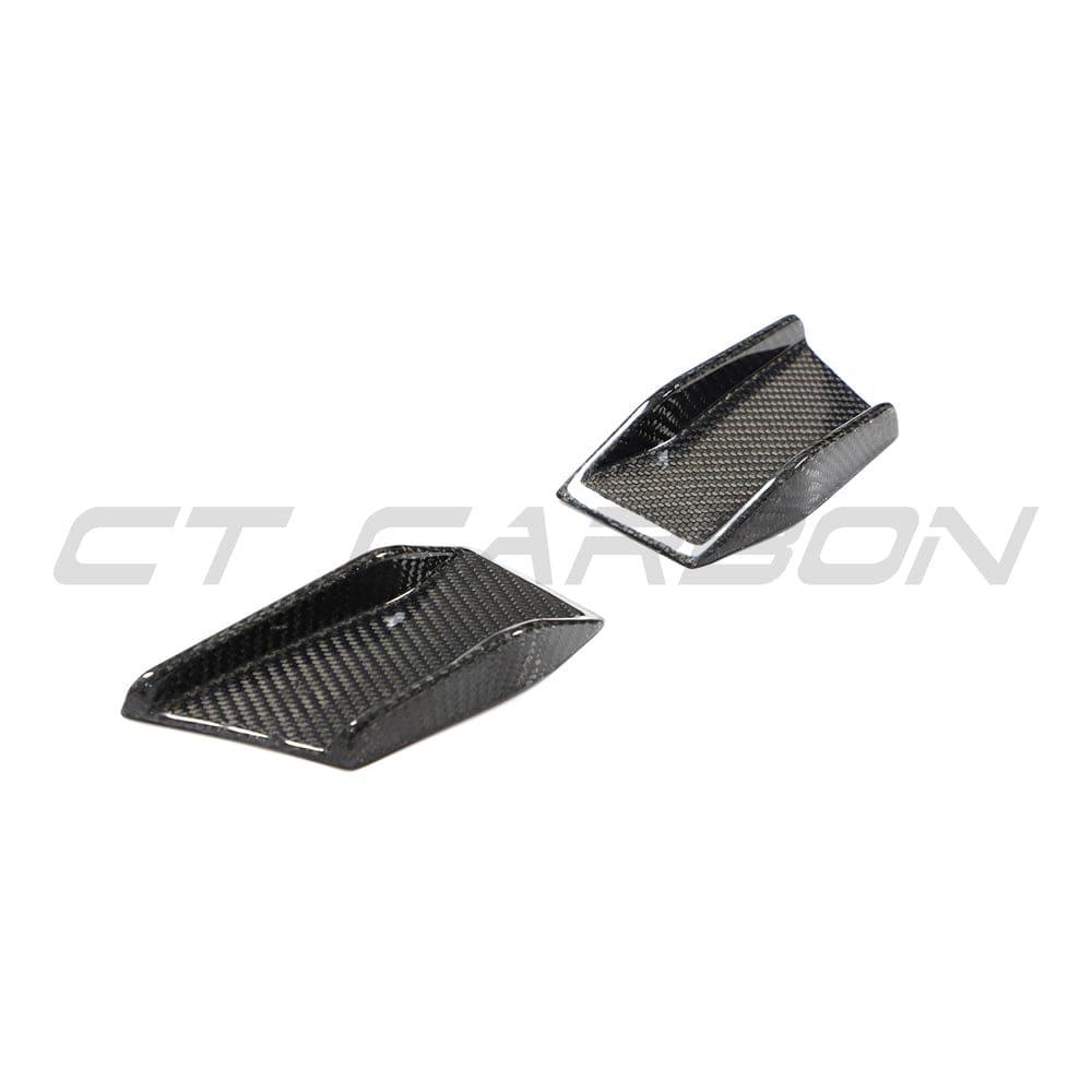 BMW 4 Series G22 G23 carbon fiber canards installed on front bumper, lightweight automotive accessories by CT Carbon.