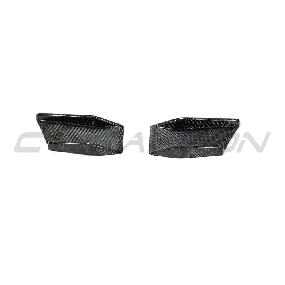 BMW 4 Series G22 G23 carbon fiber canards by CT Carbon, close-up view of aerodynamic accessories on the car's front bumper.