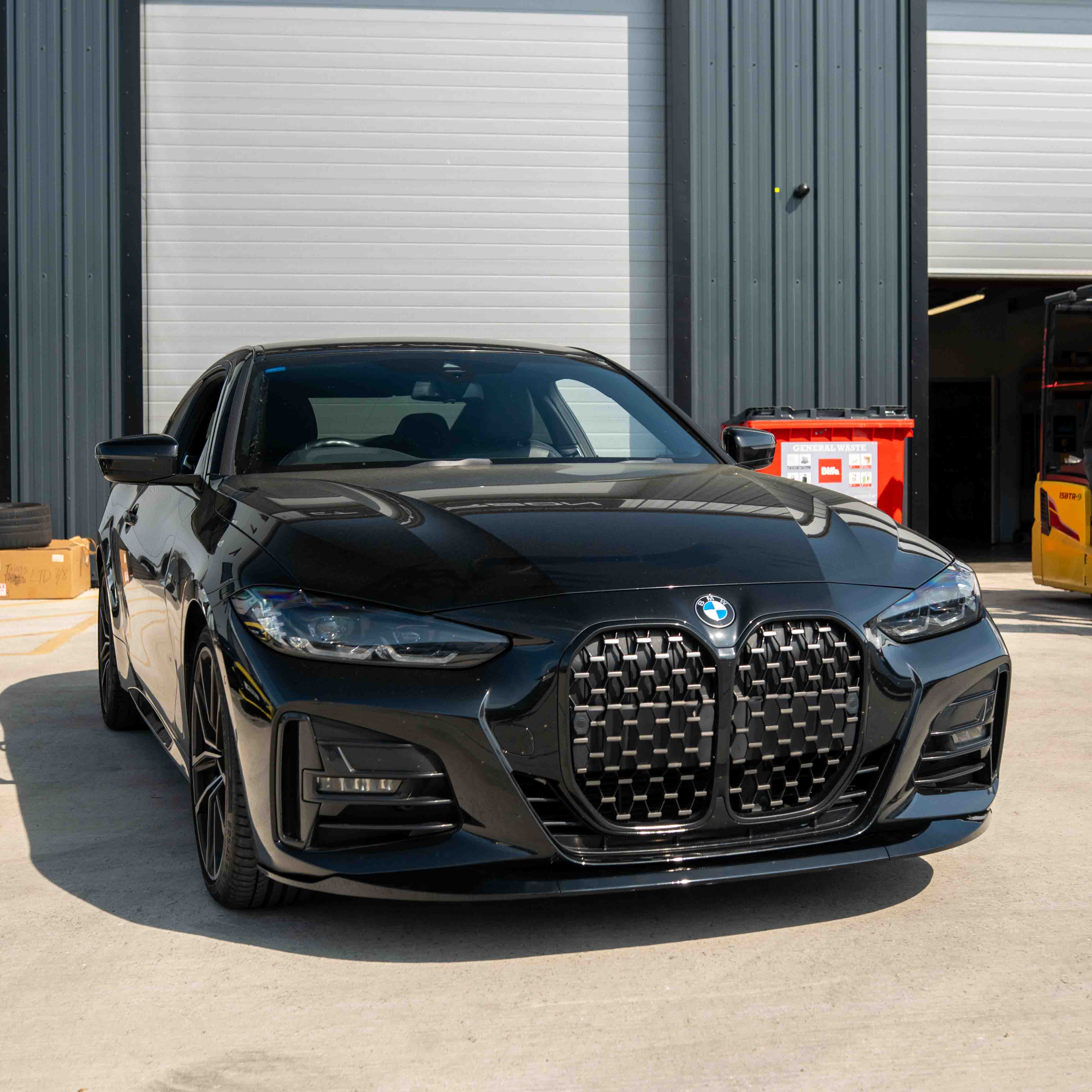 BMW 4 Series G22 G23 CT Carbon gloss black splitter, V1 style, shown attached to the front bumper of the vehicle.