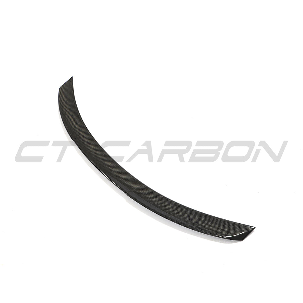BMW 4 Series G26 and i4 carbon fibre spoiler by CT Carbon, M-style design, mounted on the car's rear for enhanced aerodynamics.