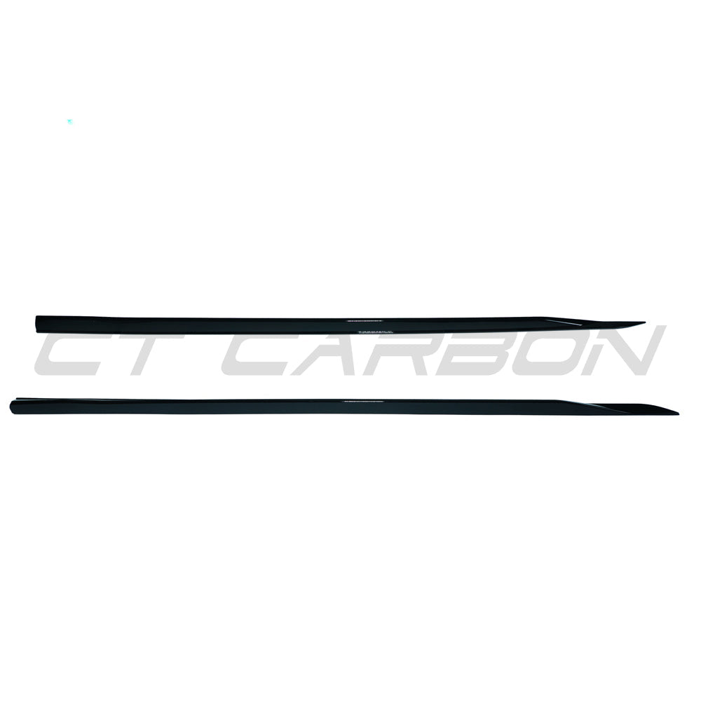 BMW 5 Series G60 2023 gloss black side skirts by CT Carbon, showing sleek, aerodynamic exterior enhancements for the vehicle.