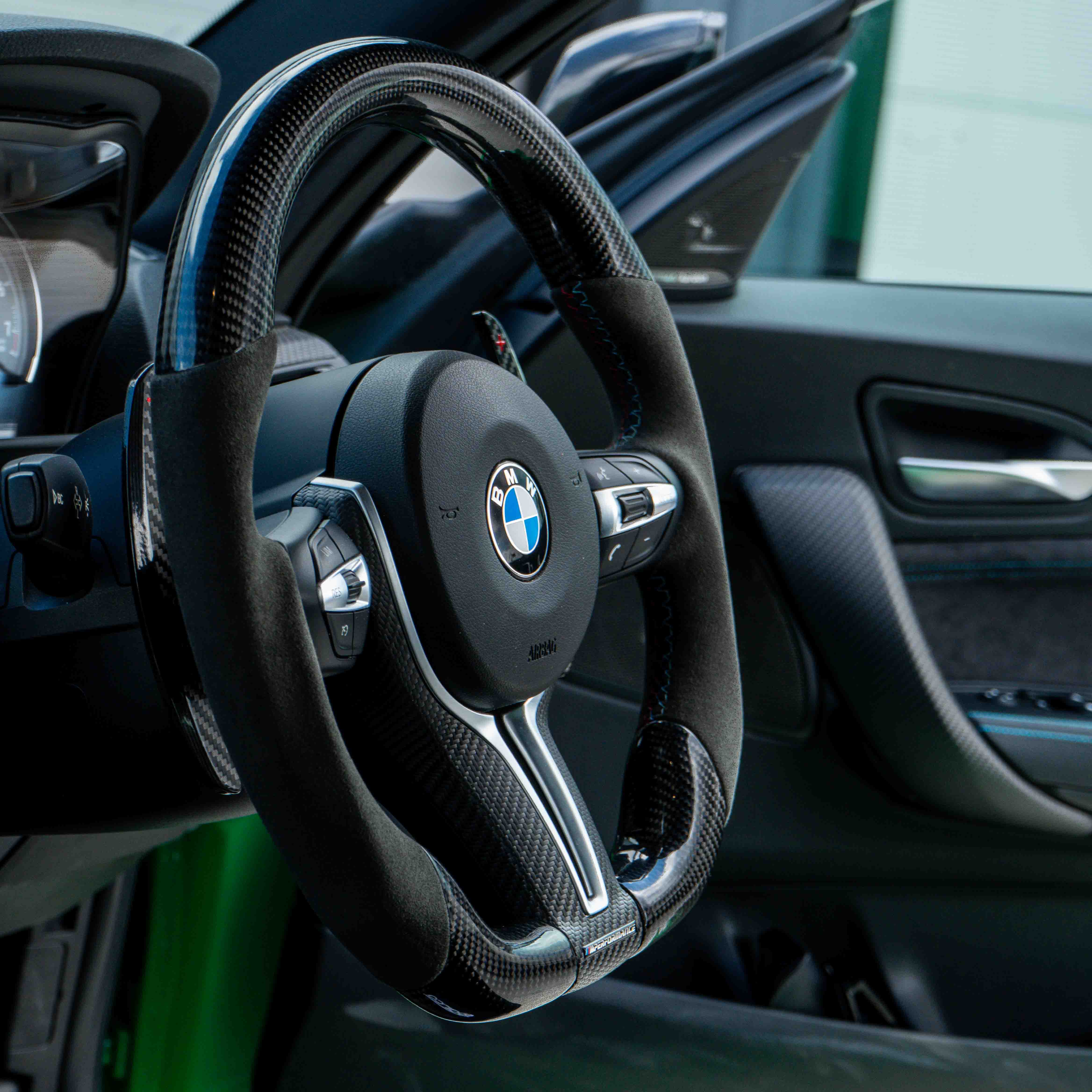 BMW carbon fiber magnetic shifter paddles by CT Carbon, sleek racing-style accessories for BMW steering wheel.