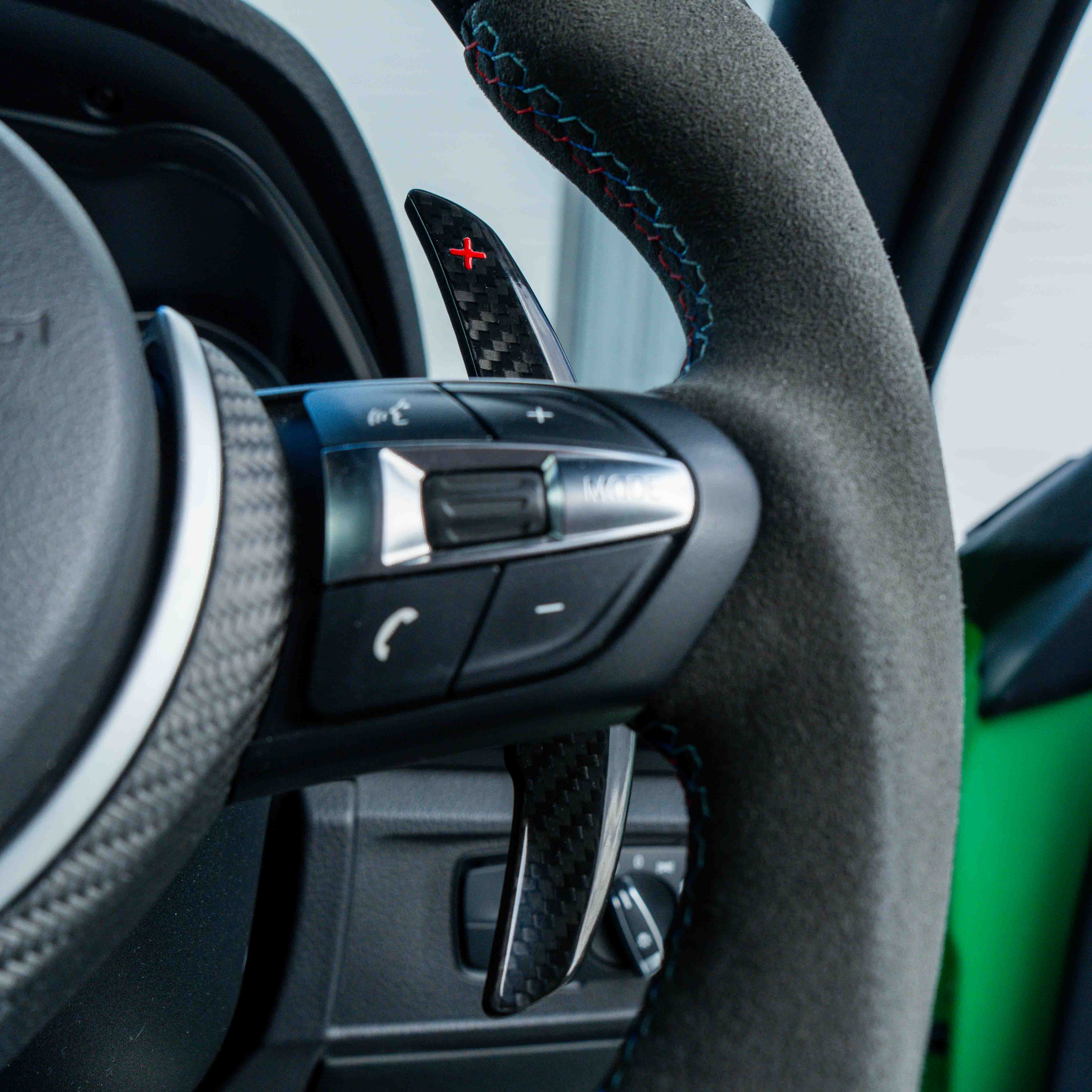 BMW carbon fiber magnetic shifter paddles by CT Carbon, sleek and lightweight accessory for enhanced driving control.