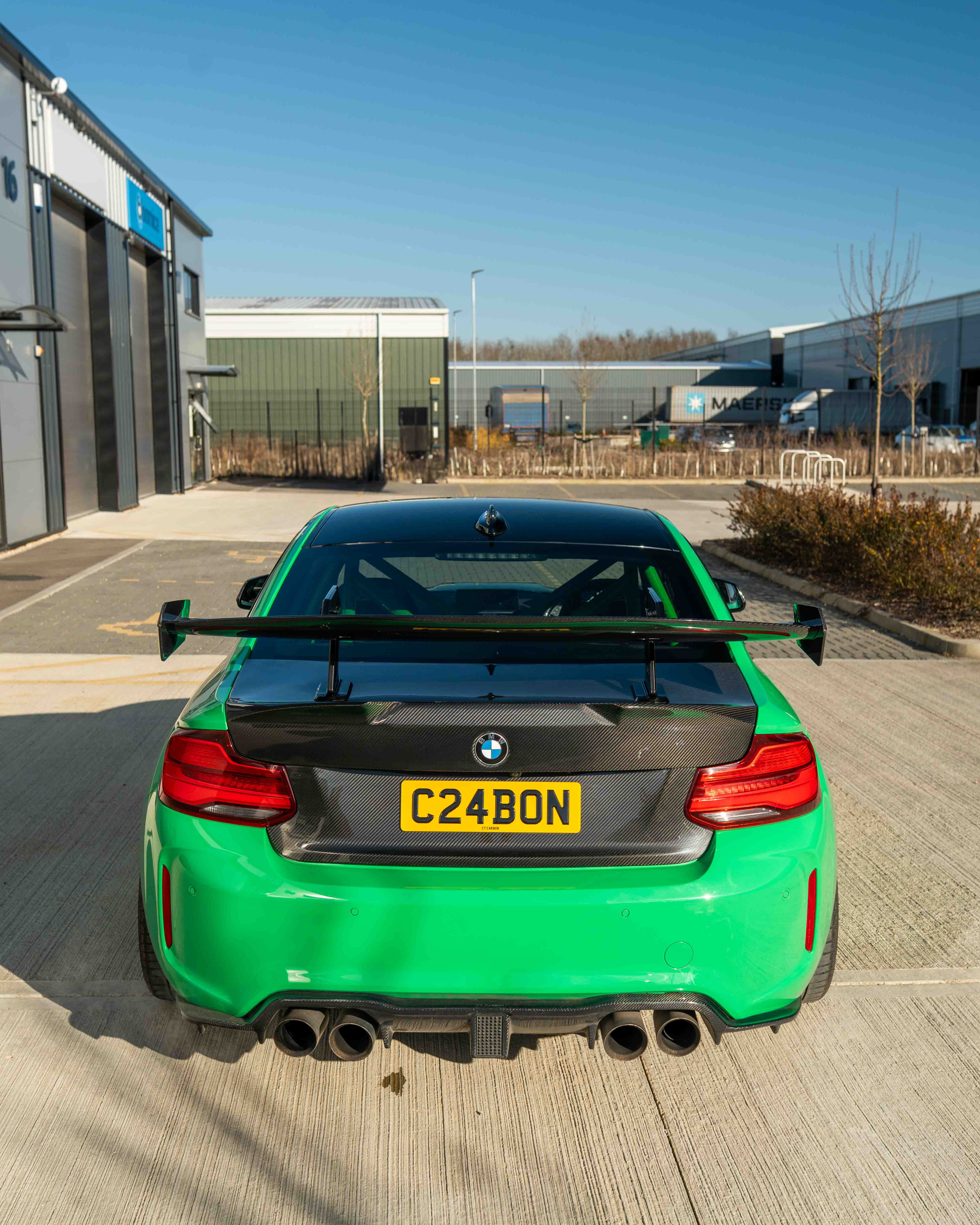 BMW F87 M2 and F22 2 Series carbon fibre swan neck wing spoiler by CT Carbon, showcasing sleek aerodynamic design.