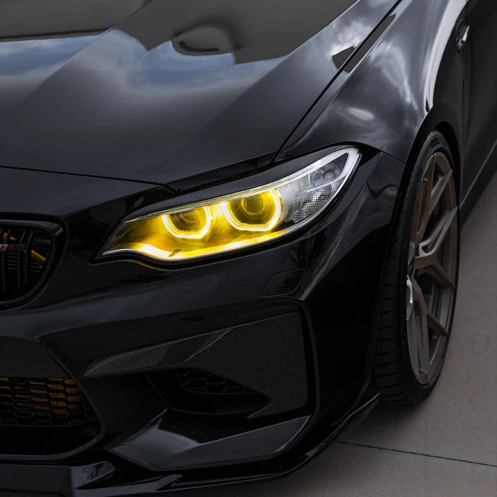 BMW F87 M2 M2C pre-LCI yellow xenon DRL module set by CT Carbon, showing the bright yellow xenon daytime running lights.