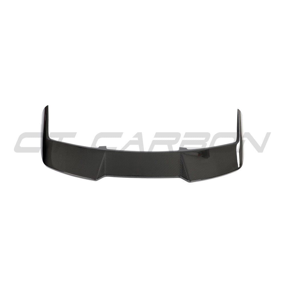 BMW F95 X5M 2019-2024 carbon fiber roof spoiler by CT Carbon, showing the sleek, aerodynamic design on the vehicle's roof.