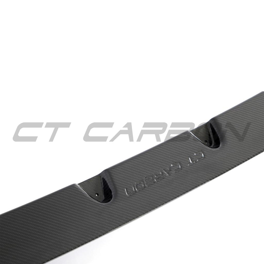 BMW F95 X5M 2023+ carbon fibre splitter by CT Design, showing the sleek, textured carbon fiber surface on the front splitter.