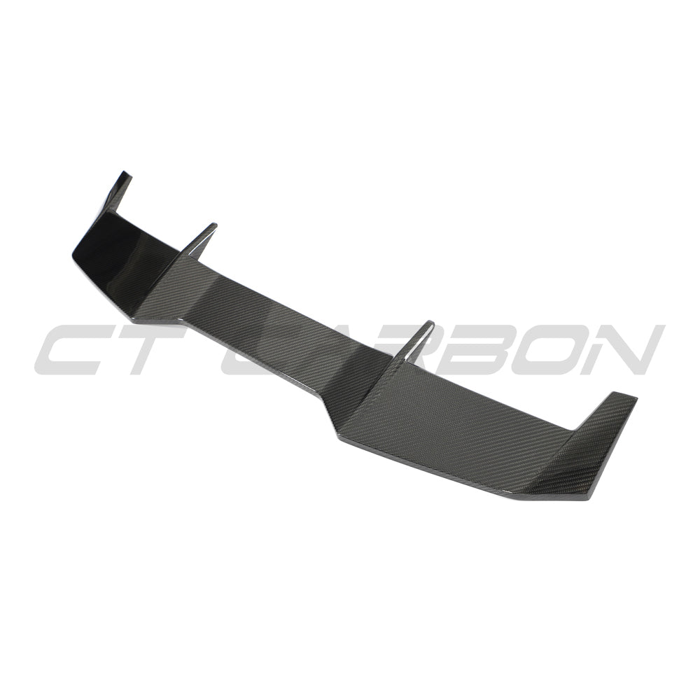BMW F96 X6M and G06 X6 carbon fibre roof spoiler by CT Carbon, showcasing sleek aerodynamic design on the vehicle roof.