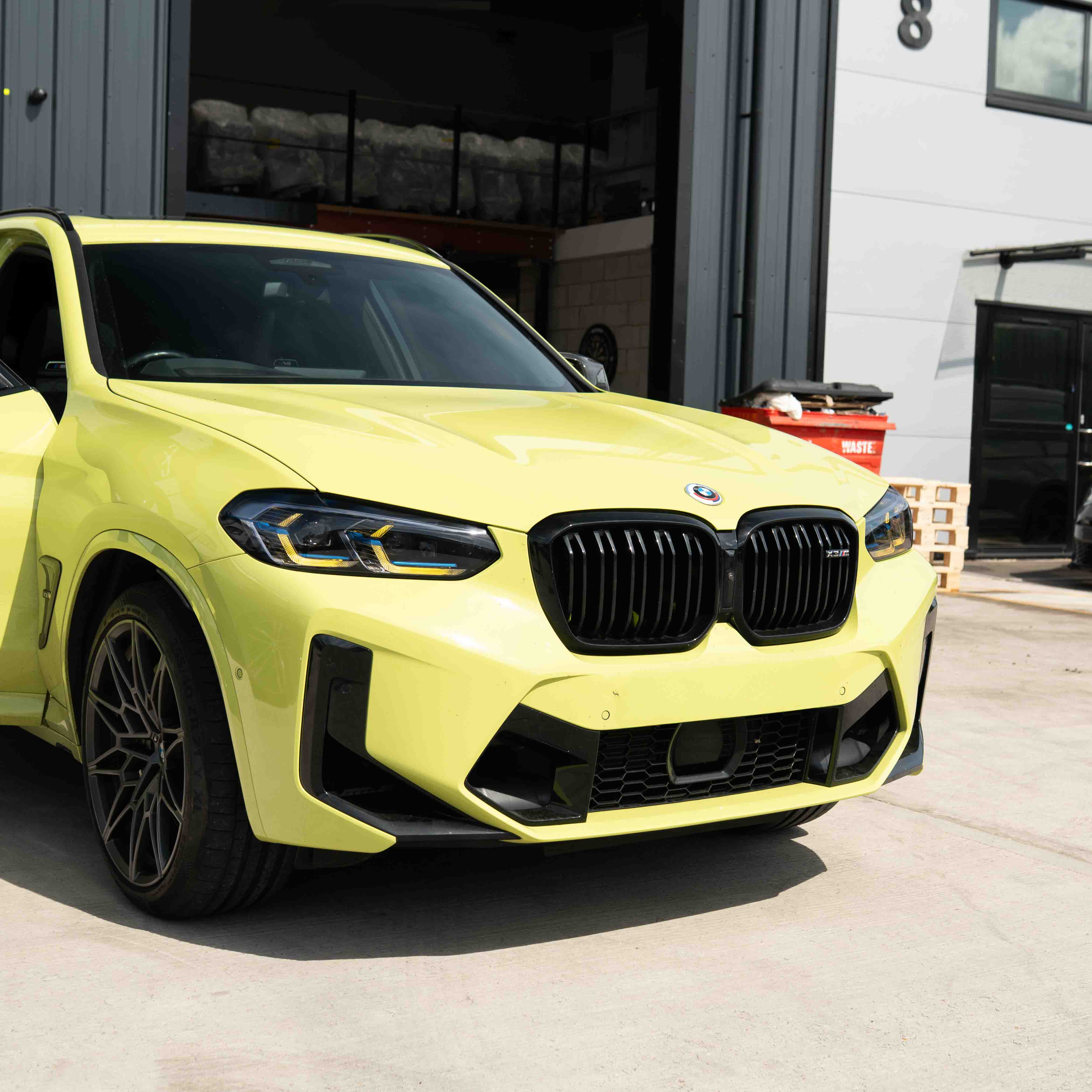 BMW F97 X3M LCI yellow adaptive DRL module set by CT Carbon, showing the sleek yellow daytime running lights for 2022+ models.