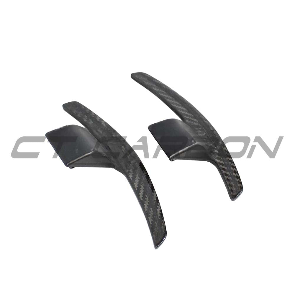 BMW Fxx carbon fibre shifter paddles V2 by CT Carbon, close-up view showing sleek black finish and detailed craftsmanship.