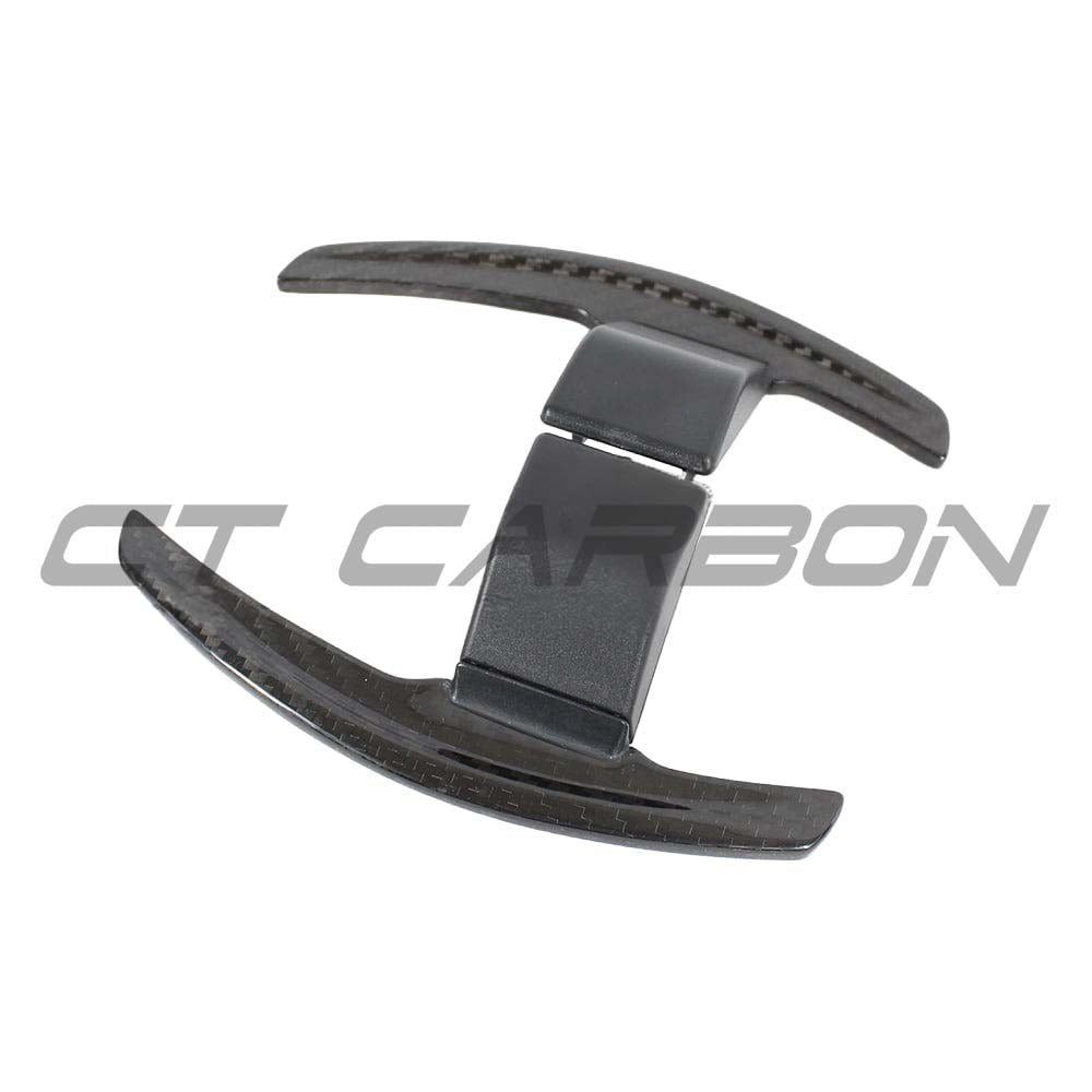 BMW Fxx carbon fibre shifter paddles V2 by CT Carbon installed in a vehicle, showcasing sleek black carbon fibre finish and ergonomic design.