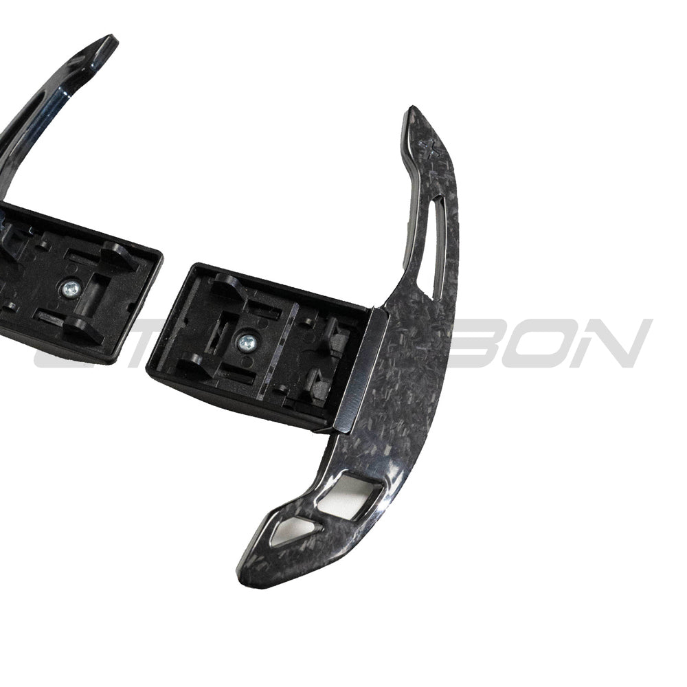 BMW Fxx forged carbon fiber shifter paddles V3 by CT Carbon, showing sleek black carbon fiber surface and ergonomic design.
