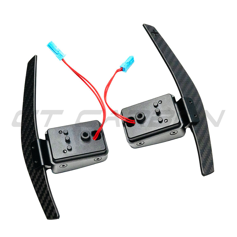 BMW Fxx matte carbon fiber magnetic shifter paddles by CT Carbon, featuring sleek design and lightweight construction for sporty driving.