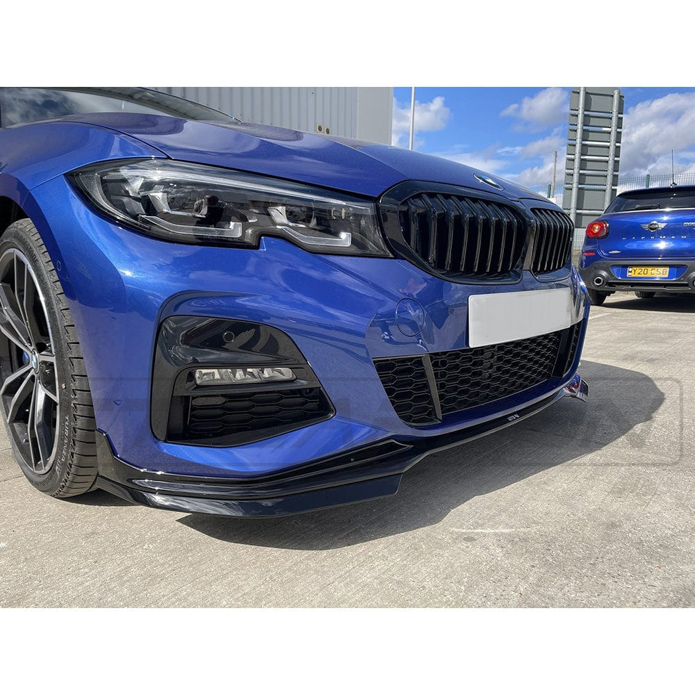 BMW G20 3 Series pre-LCI 2018-2022 gloss black exhaust tip kit with round tips by CT Carbon, shown on the rear of the vehicle.