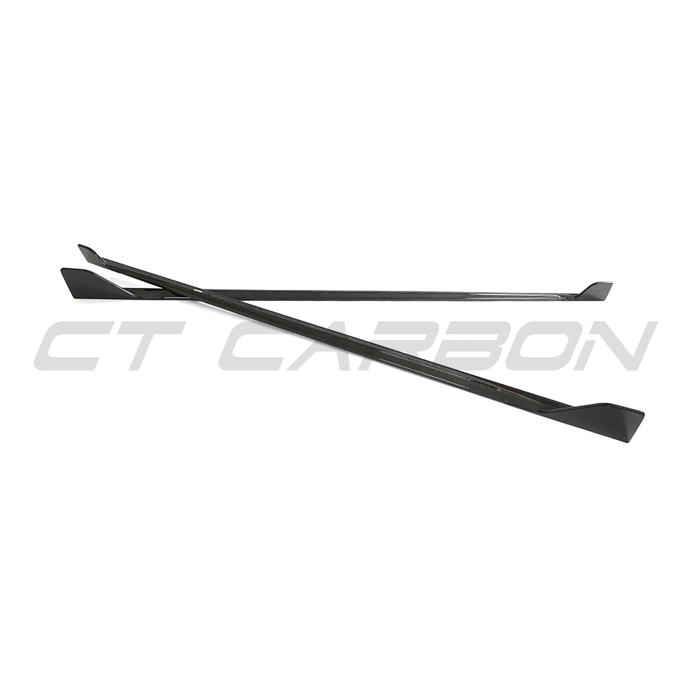 BMW G42 2 Series carbon fibre full-length side skirts by CT Carbon installed on the vehicle, enhancing sporty appearance.