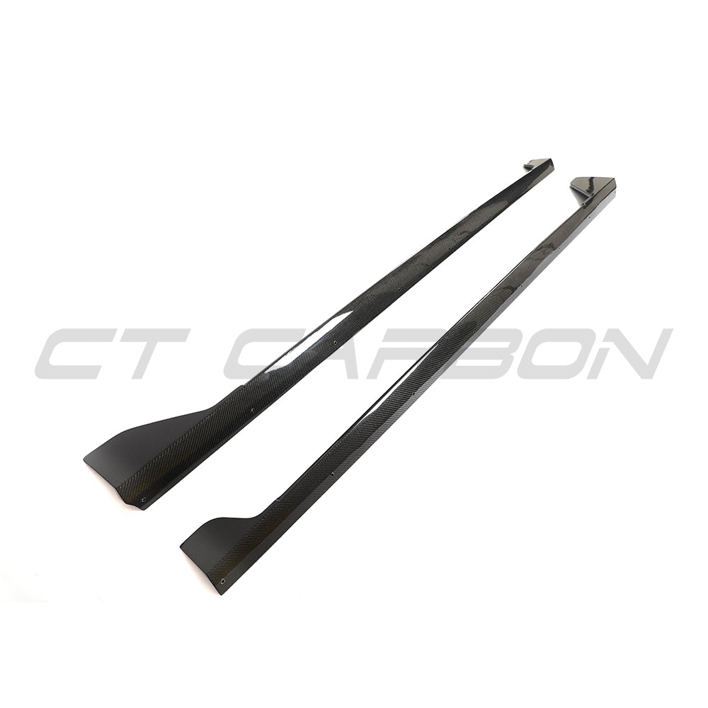 BMW G42 2 Series Carbon Fibre full-length side skirts by CT Carbon, showcasing sleek, lightweight automotive styling.