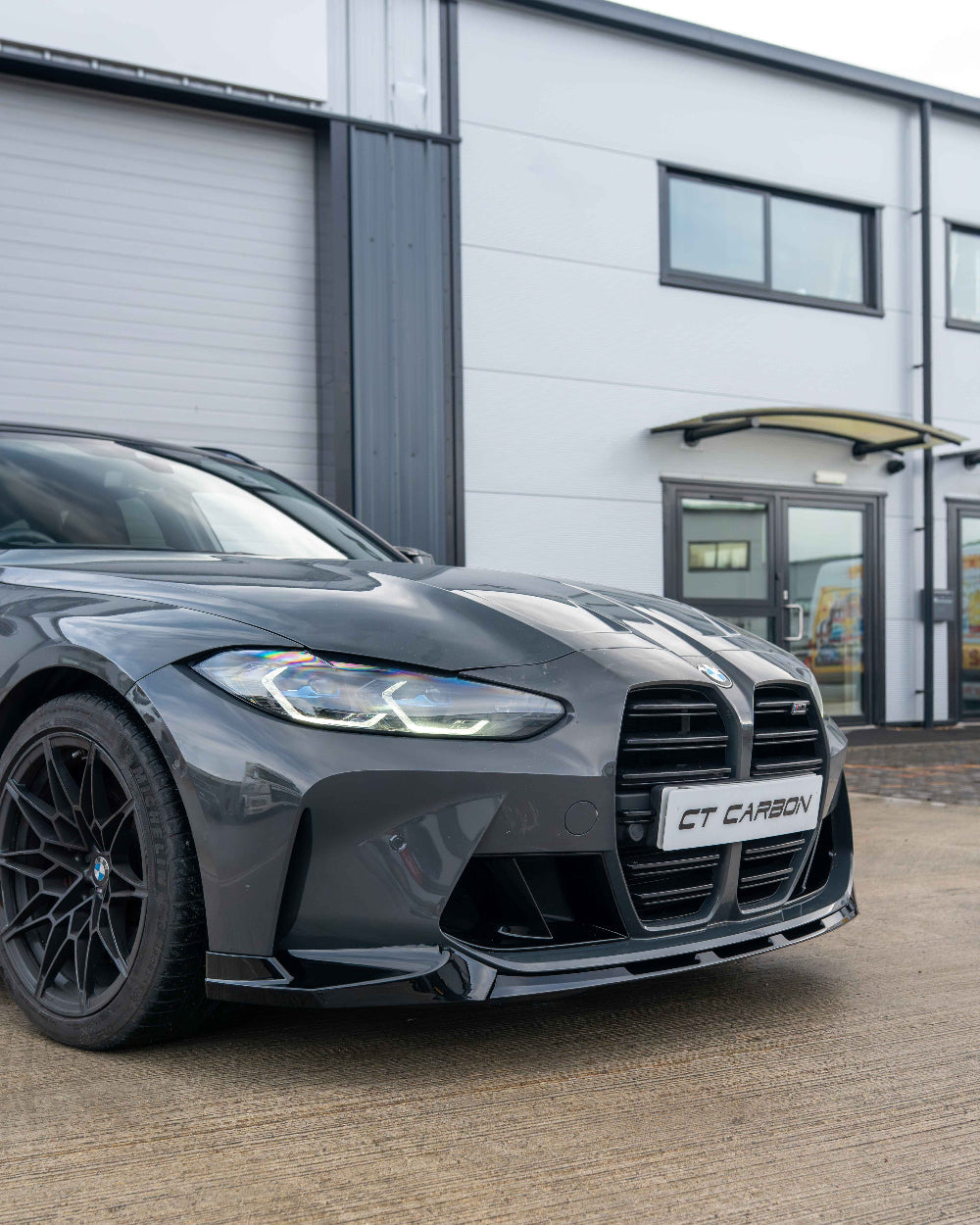 BMW M3 and M4 G80 G81 G82 G83 gloss black splitter by CT Carbon, showing the sleek, aerodynamic front splitter design.