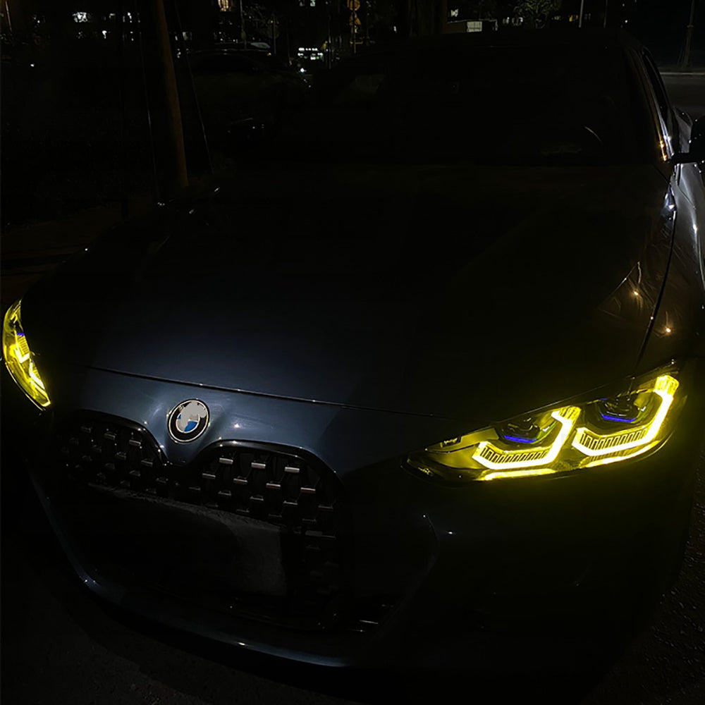 BMW G80 G81 G82 G83 M3 M4 yellow adaptive DRL module set by CT Carbon, showing the LED daytime running lights on the vehicle.