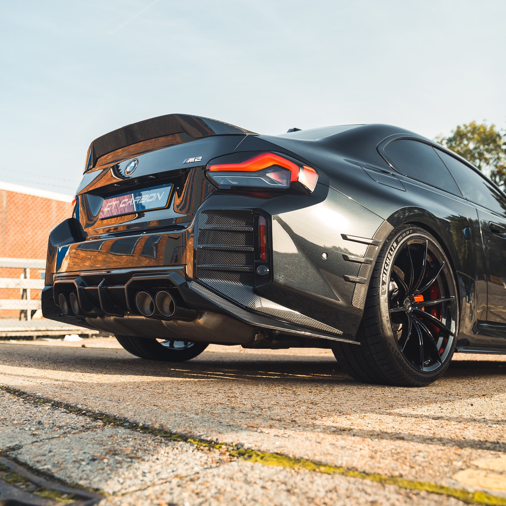 BMW G87 M2 carbon fibre diffuser by CT Carbon, V1 model, showcasing sleek lightweight aerodynamic design.