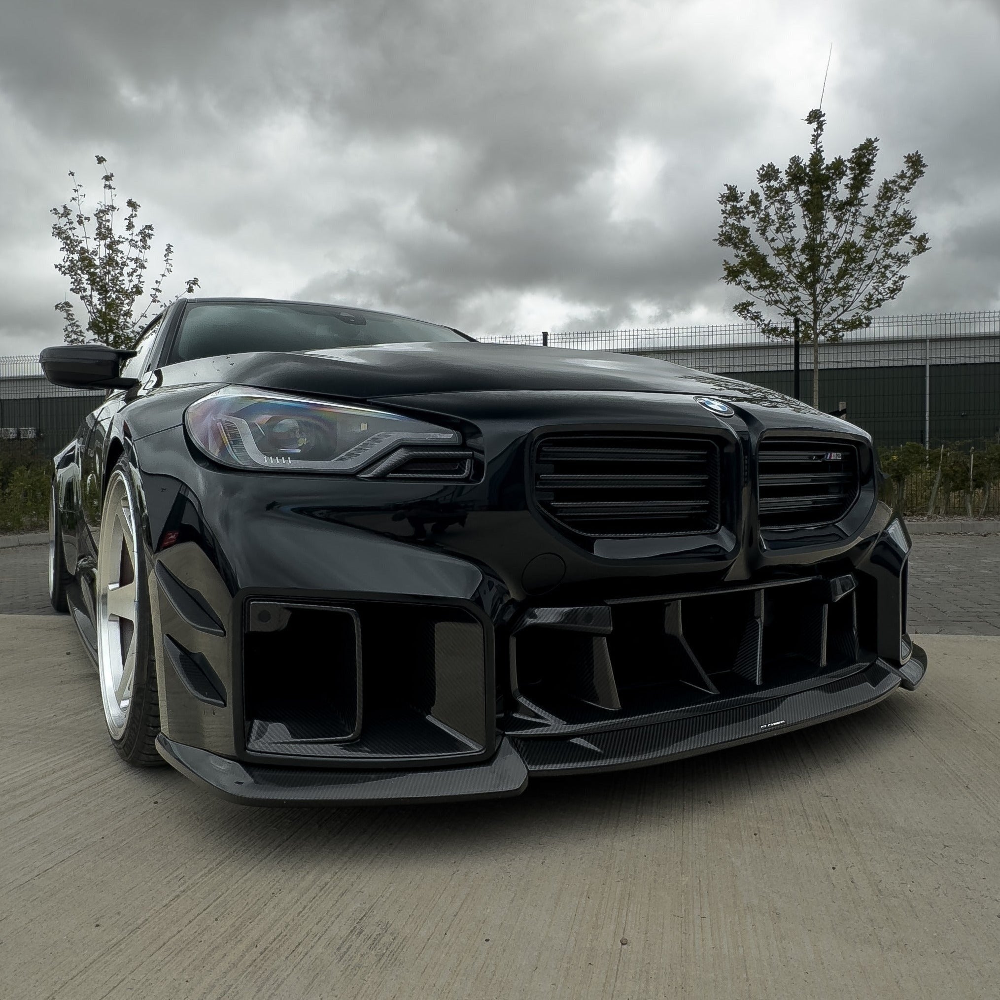 BMW G87 M2 carbon fibre ducts by CT Design, V2 accessories, close-up of lightweight, aerodynamic carbon fibre ducts for performance.