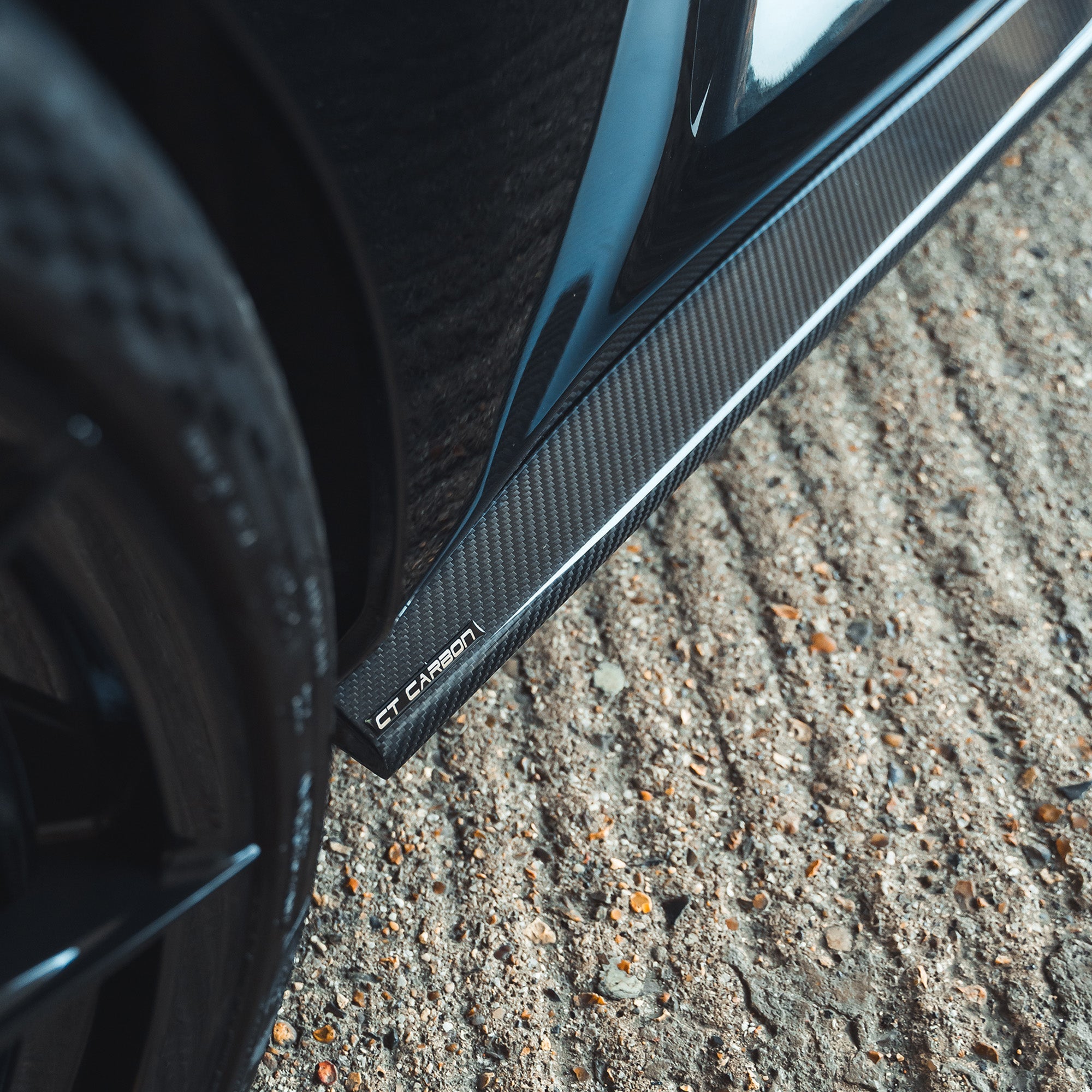 BMW G87 M2 carbon fibre side skirts by CT Design, sleek aerodynamic side skirts with a carbon fiber finish.
