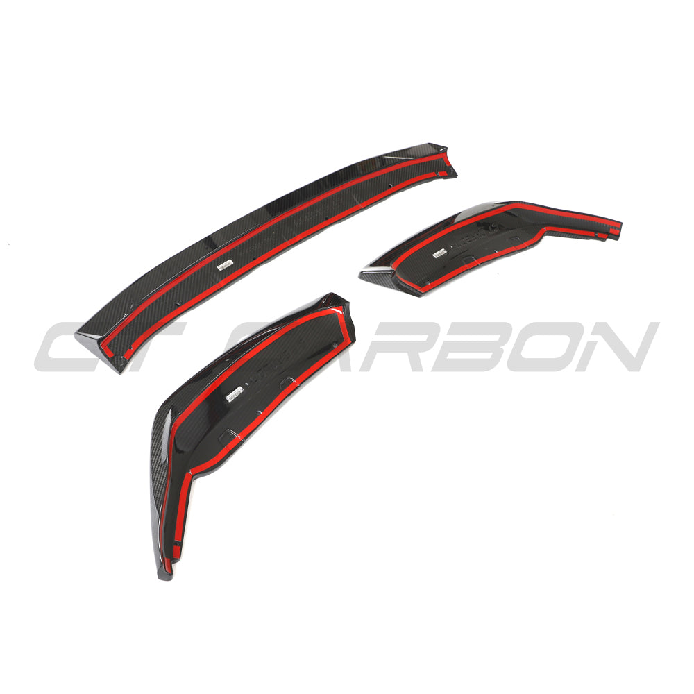 BMW G87 M2 carbon fiber splitter by CT Design, showing the sleek, lightweight aerodynamic front splitter with detailed carbon weave.