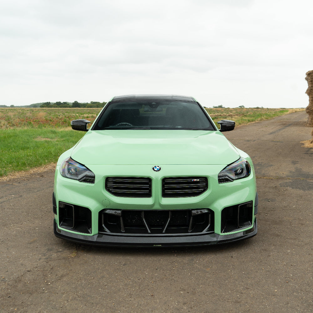 BMW G87 M2 carbon fiber lower grille accessory by CT Carbon, showcasing the V1 carbon fiber design with a sleek, sporty finish.
