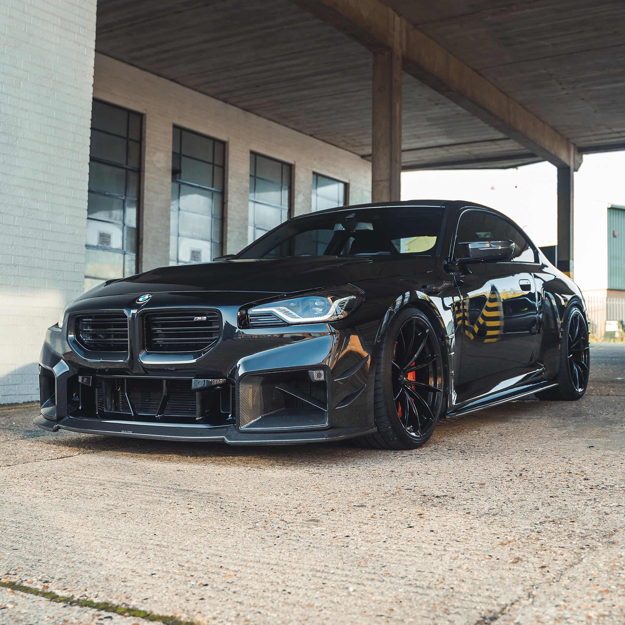 BMW G87 M2 full carbon fiber kit by CT Design, showcasing lightweight, high-gloss carbon fiber parts on the car.