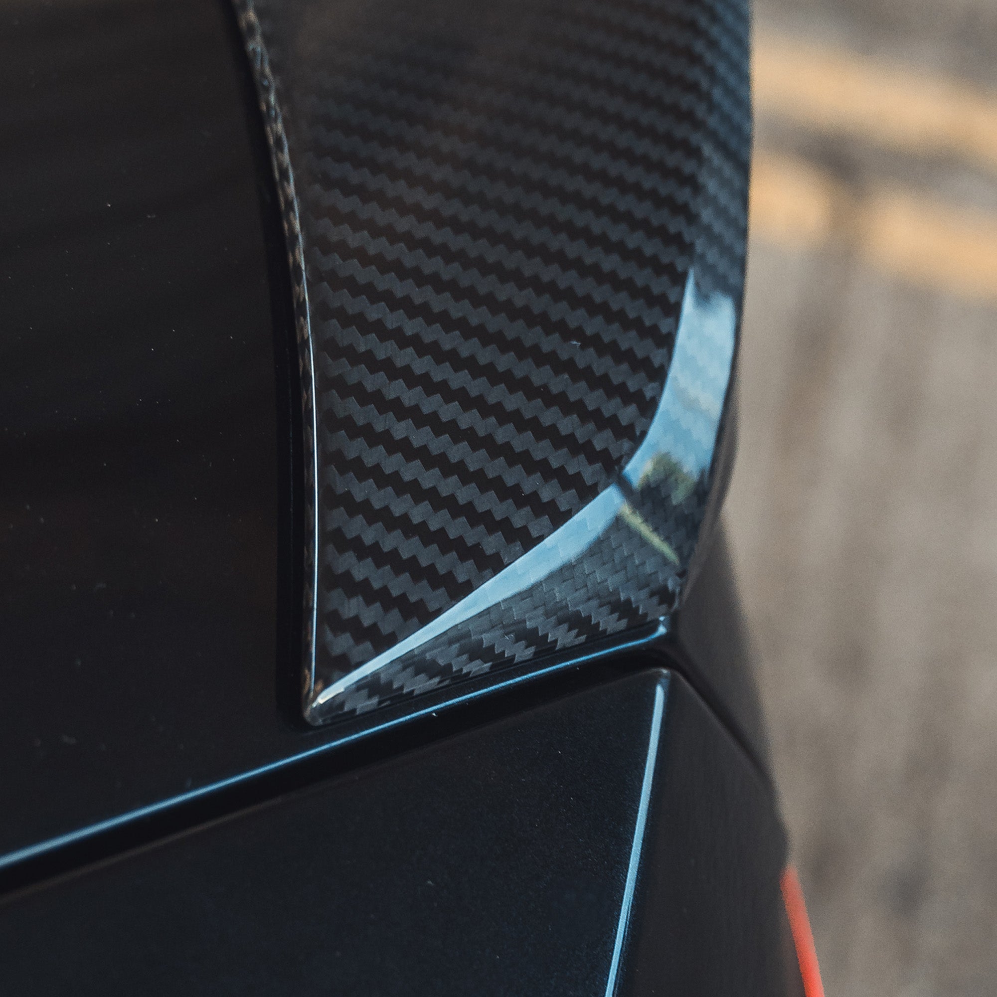 BMW G87 M2 and G42 2 Series carbon fibre spoiler by CT Design, showcasing its sleek, aerodynamic design on a sports car.