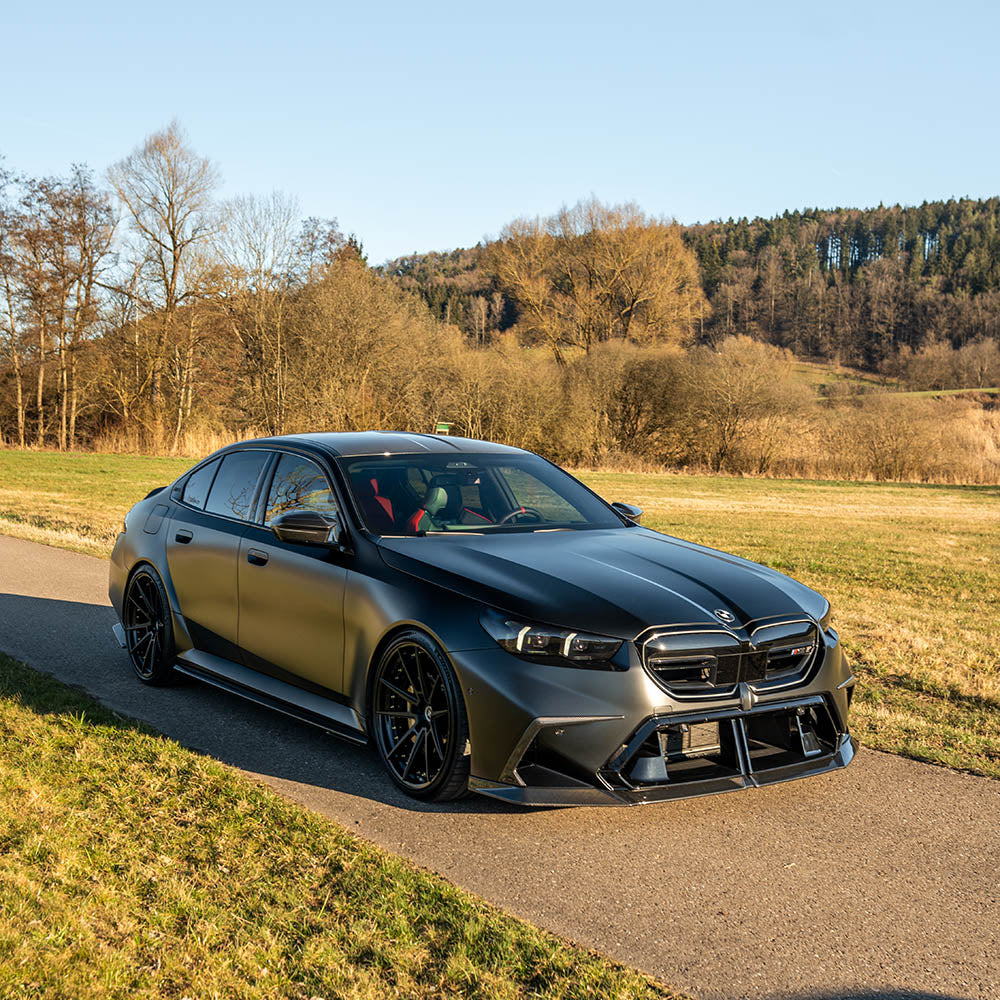 BMW G90 M5 carbon fibre full kit by CT Design, showcasing lightweight, aerodynamic body panels and detailed carbon fibre finish.