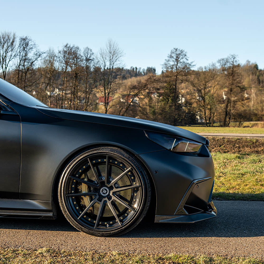 BMW G90 M5 and G99 M5 Touring 2024 carbon fibre splitter kit by CT Design, showing the sleek, lightweight front splitter.