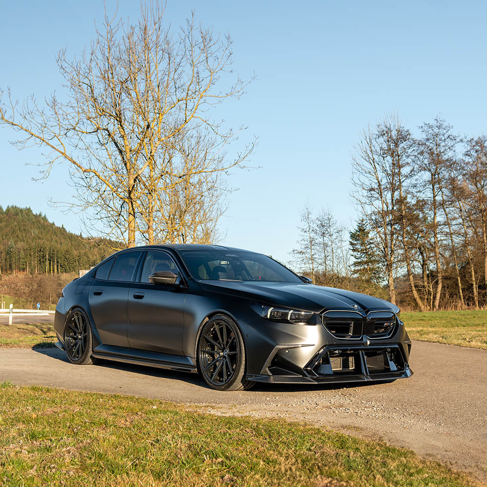 BMW G90 M5 carbon fiber full kit by CT Design, featuring aerodynamic parts and sleek carbon fiber details for enhanced performance.