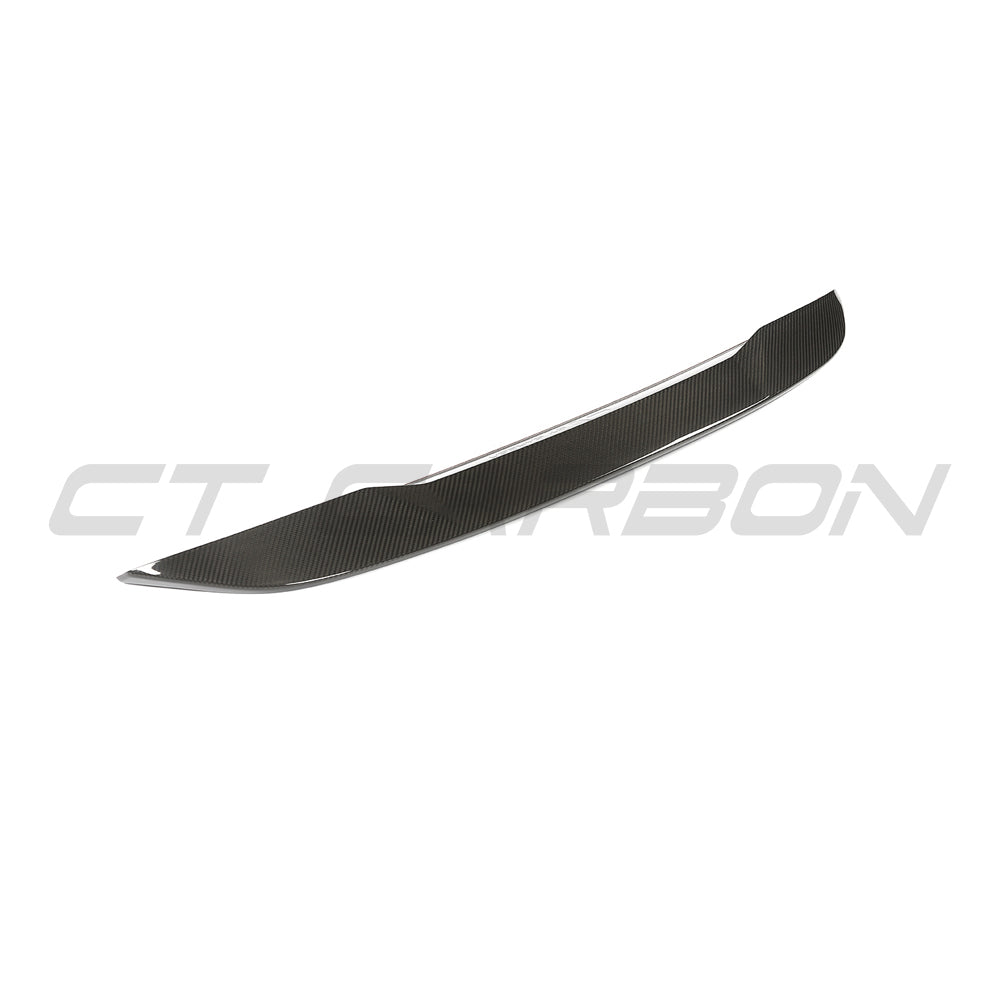 BMW G60 5 Series and I5 2023 full carbon fibre kit by CT Carbon showing carbon fiber spoiler and kit components on the car.