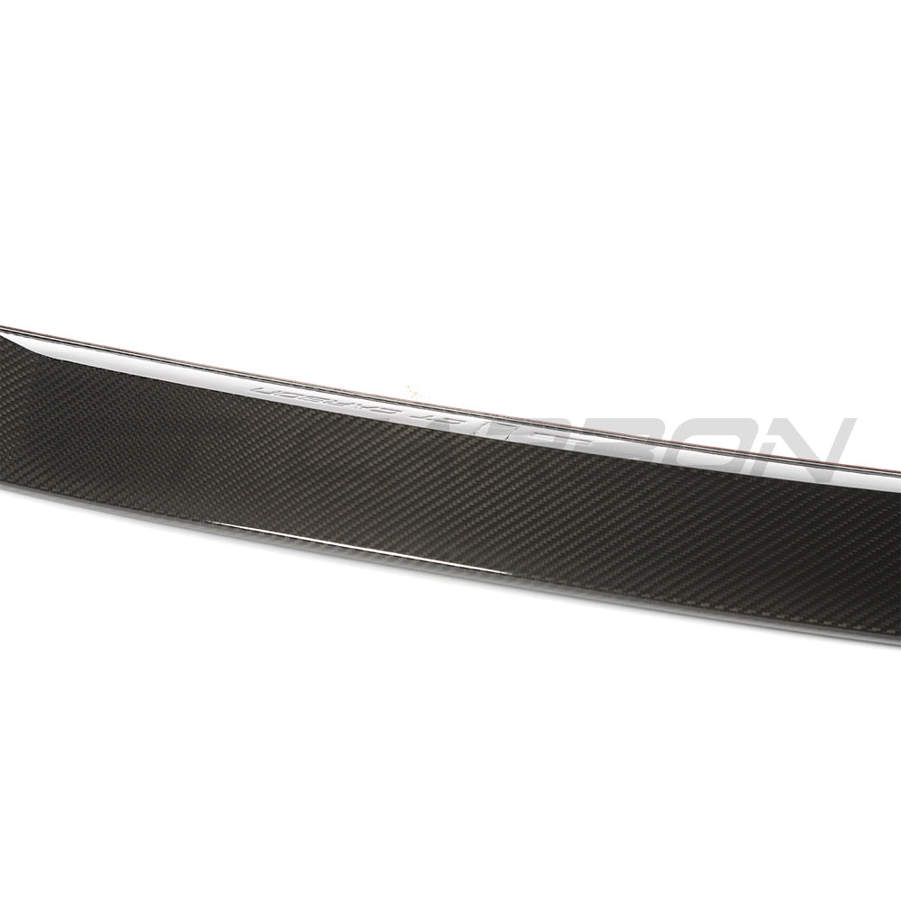 BMW G60 5 Series and I5 full carbon fibre kit by CT Carbon, including spoiler and body accents on a sleek car.