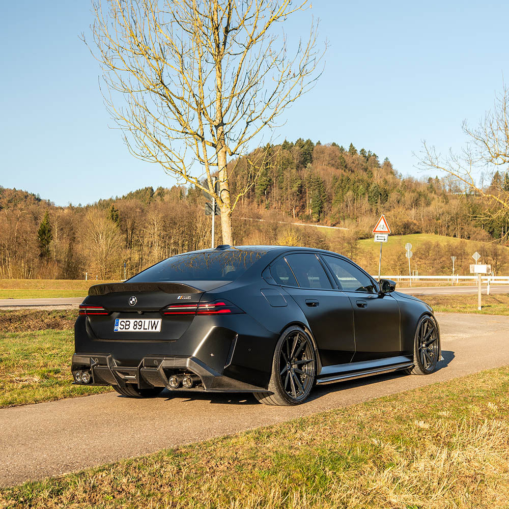BMW G90 M5 full carbon fibre kit by CT Carbon, featuring a sleek carbon fibre spoiler and exterior enhancements.