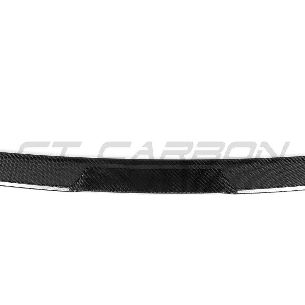 BMW G90 M5 and G60 5 Series 2023 carbon fibre spoiler by CT Carbon, showcasing the sleek aerodynamic design and glossy finish.